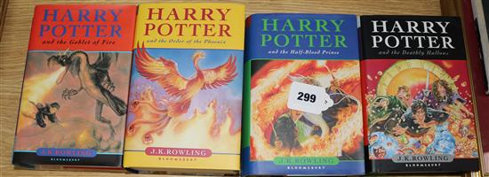 A collection of four Harry Potter 1st edition books